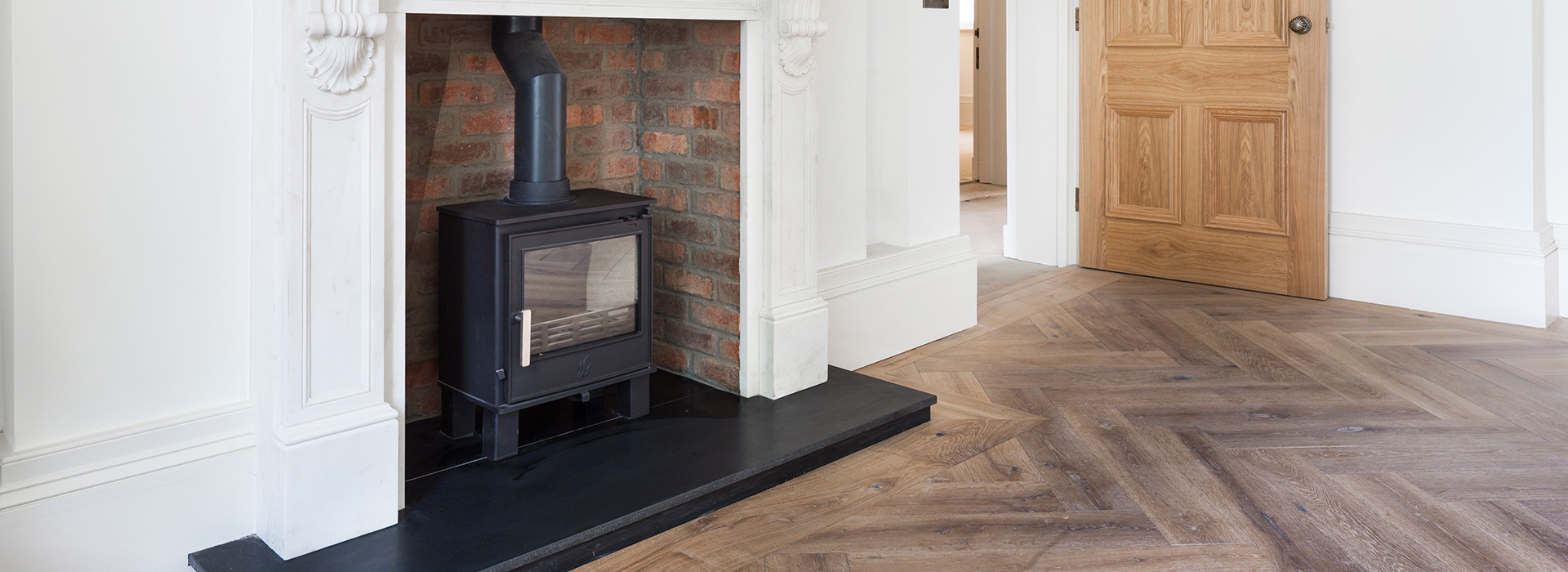 Black granite and brick fireplace